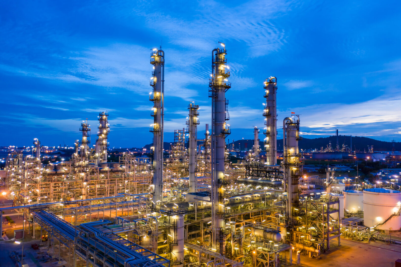 Night view of illuminated petrochemical plant.